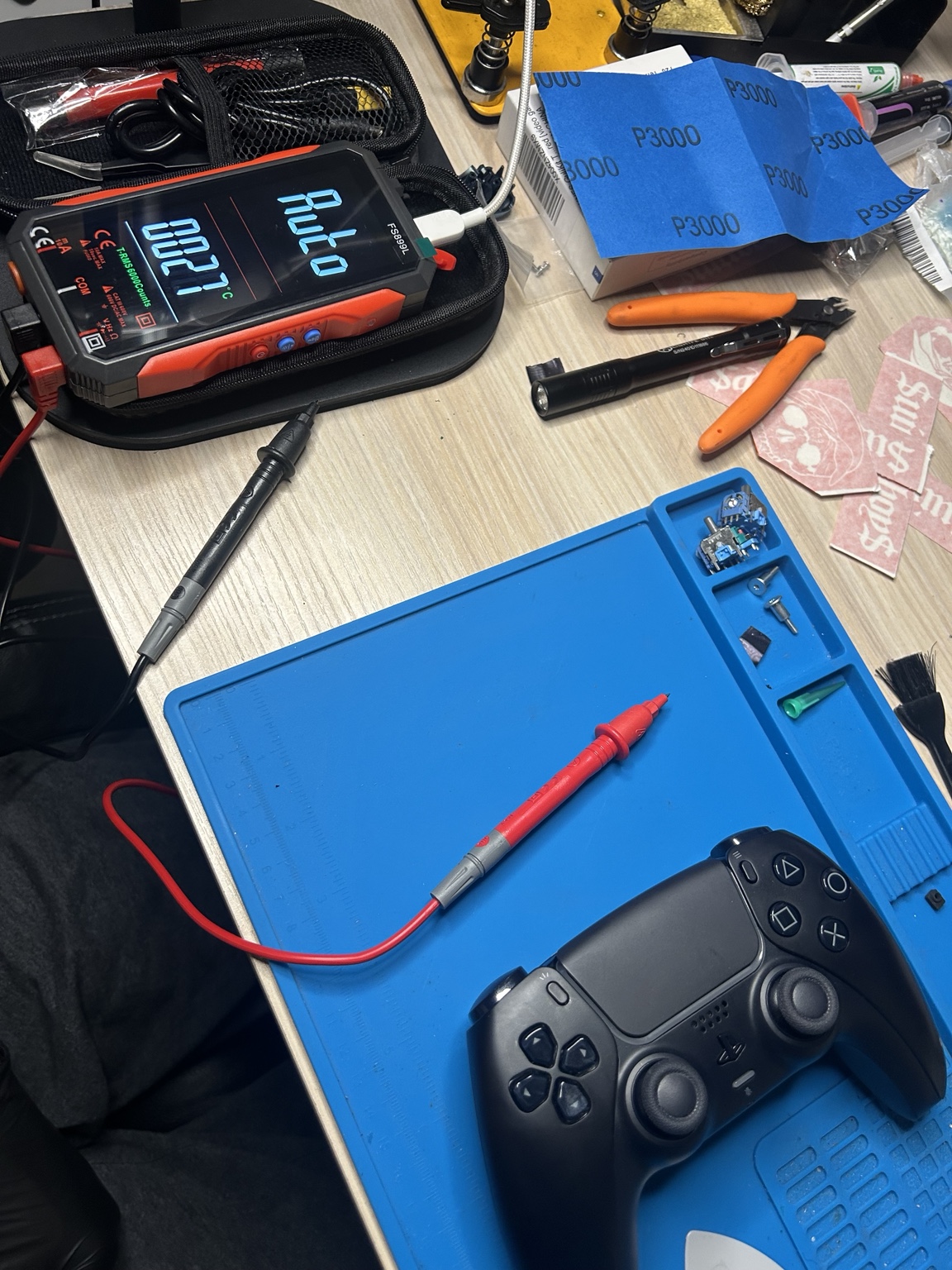 Controller being electronically tested on a repair bench