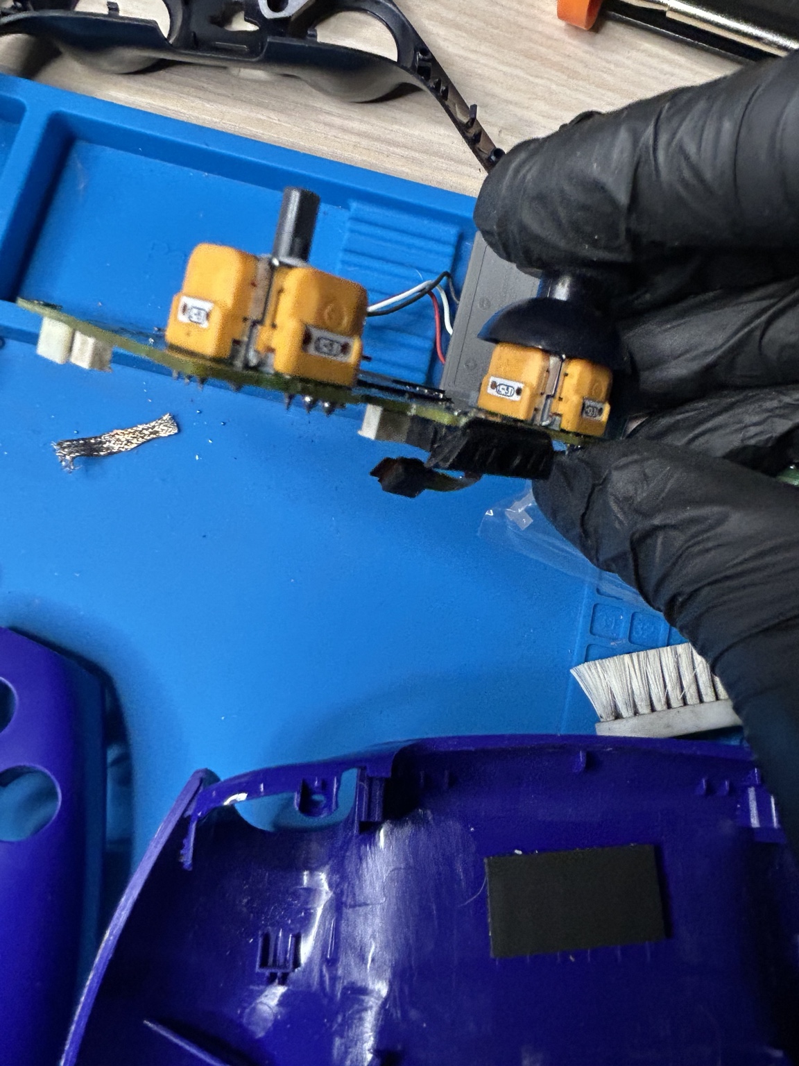 Joystick modules being replaced during a controller repair